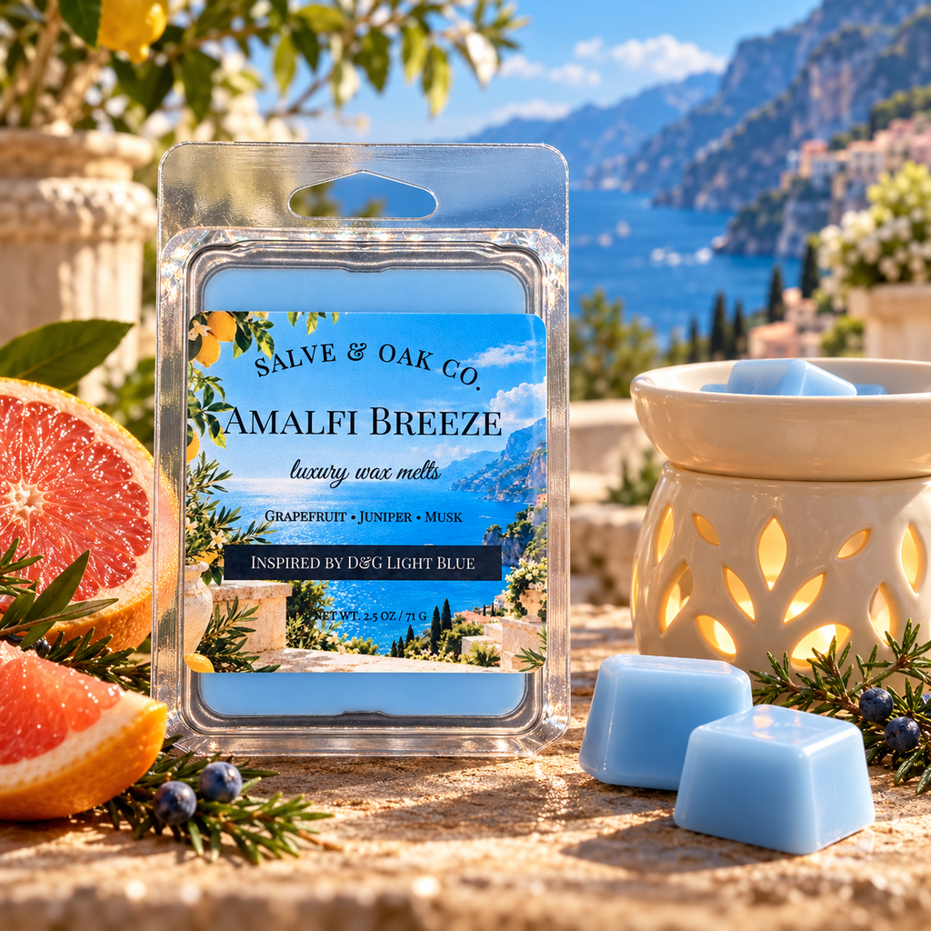 Amalfi Breeze wax melts with grapefruit, juniper, and a glowing warmer on a terrace overlooking the Mediterranean coast.