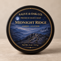 Midnight Ridge premium shave soap by Salve & Oak Co. in black tub with moonlit mountain and amber leather label