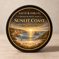 Sunlit Coast premium shave soap by Salve & Oak Co. in black tub with coastal sunset, pistachio, and salted caramel label