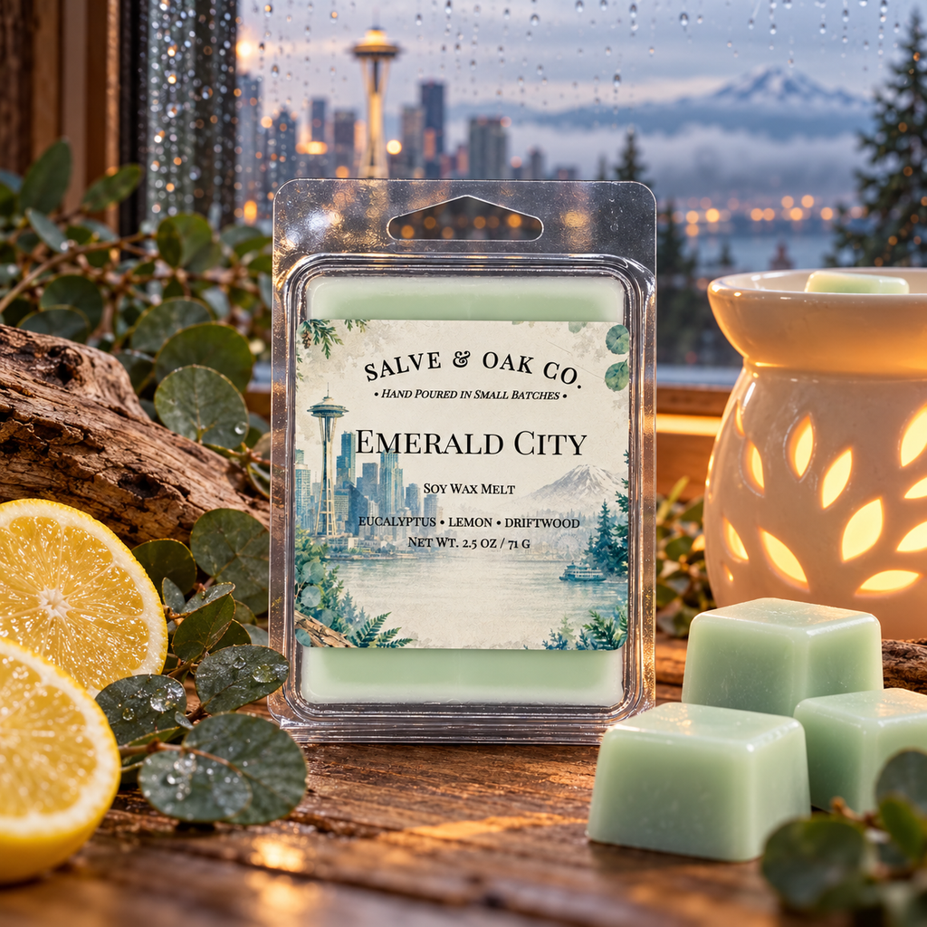 Emerald City wax melts with eucalyptus, lemon, driftwood, and a glowing warmer beside a rain-speckled window overlooking Seattle.