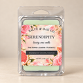 Salve & Oak Co. Serendipity wax melt clamshell with a floral label and pale green wax against a cream background.