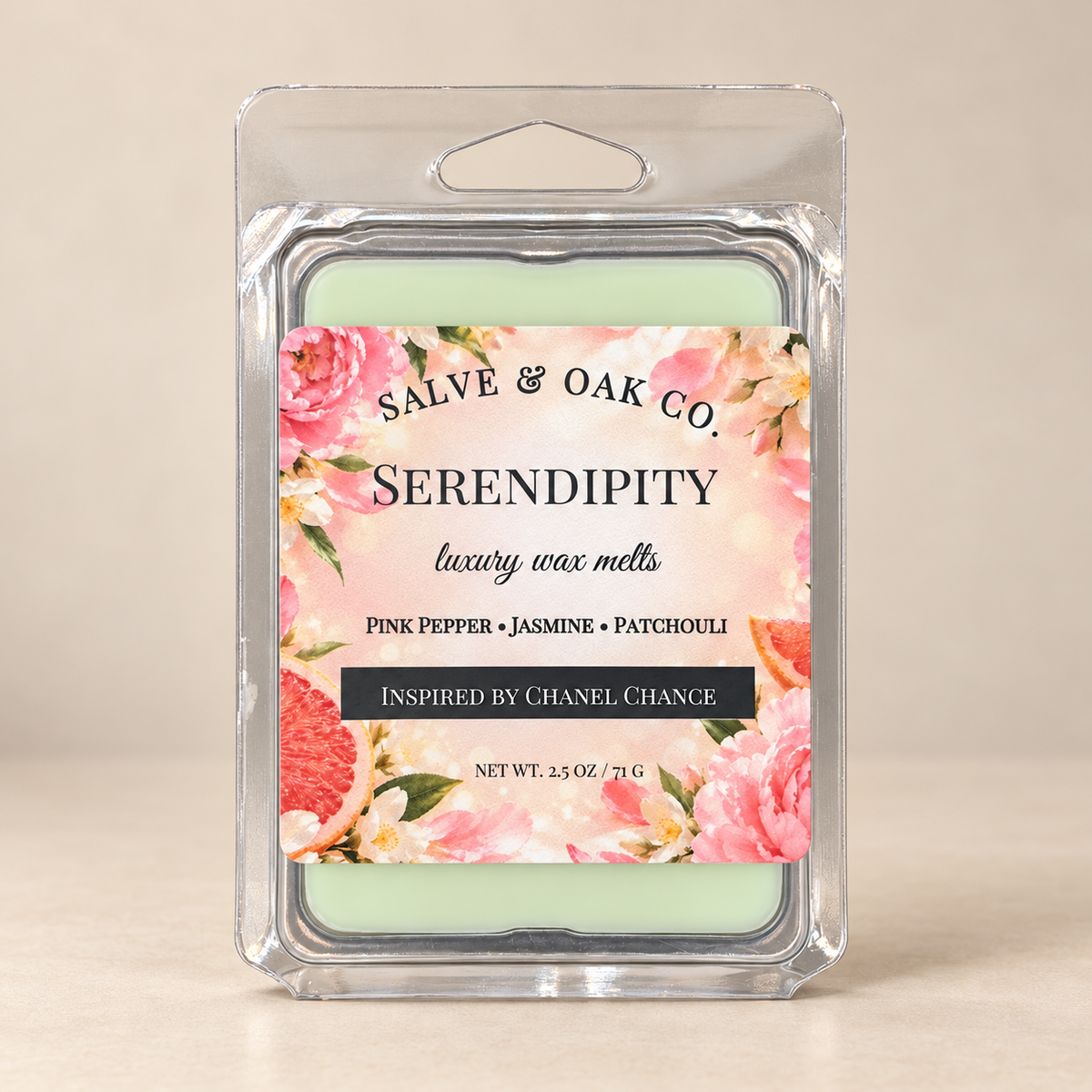 Salve & Oak Co. Serendipity wax melt clamshell with a floral label and pale green wax against a cream background.